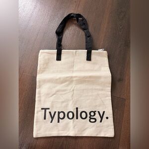 Typology. Canvas Tote Bag in Cream with Black Handles